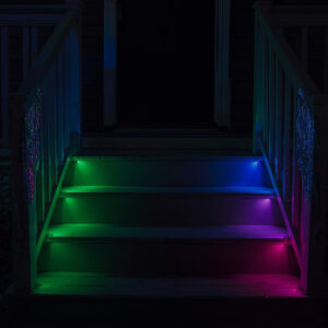 A staircase lit with glow sticks.